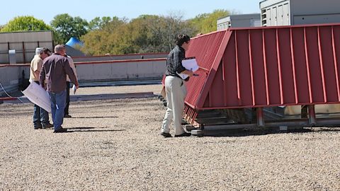 Potential bidders walk roof at Duff Elementary