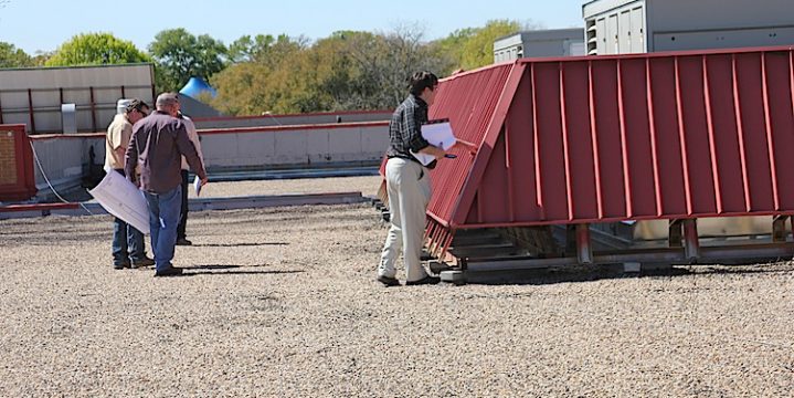 Potential bidders walk roof at Duff Elementary