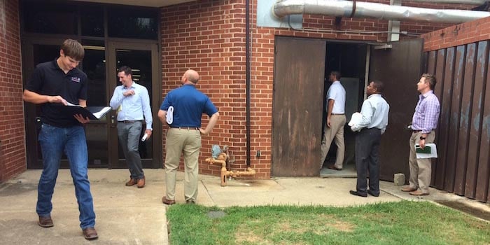 Potential bidders inspect the Corey building