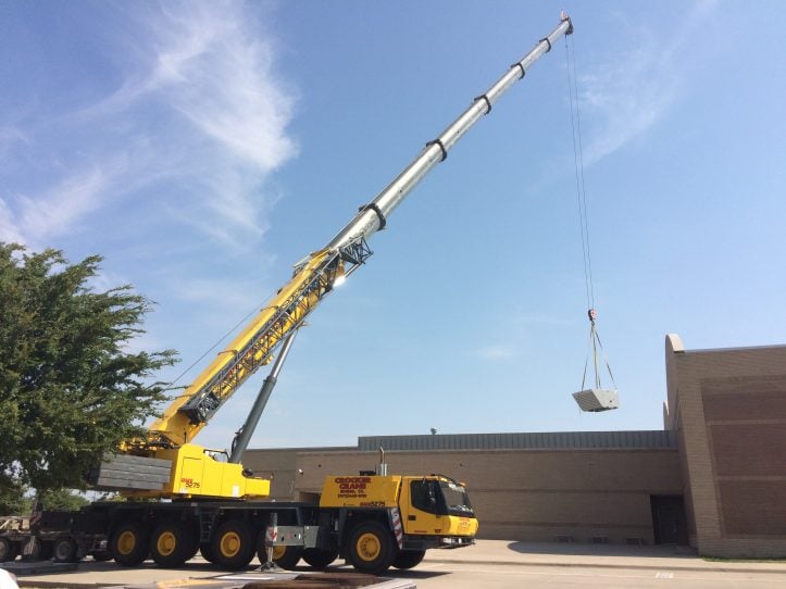 Crane lifts HVAC units to the roof of Ferguson Education Center