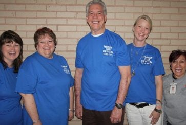 Original Ferguson staff pose for a photo together