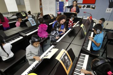 Students in Jones Academy's piano lab