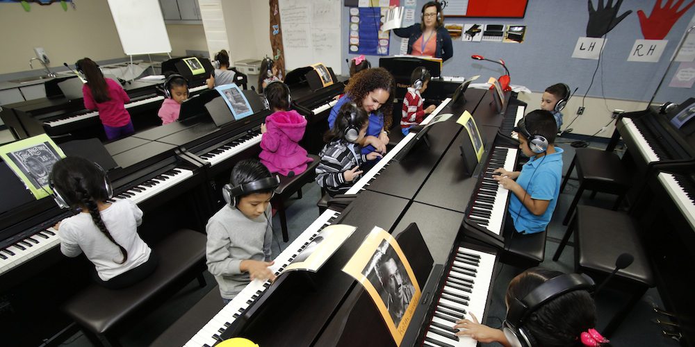 Students in Jones Academy's piano lab