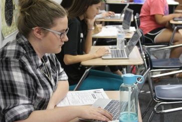 Martin student uses Chromebook in work geography class