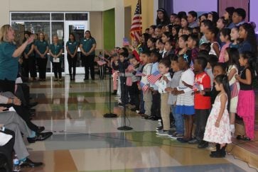 Students sing at the McNutt Elementary dedication ceremony