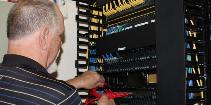 AISD technology staff install new hardware at Swift