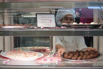 Culinary student at the CTC puts out dessert at The Bistro