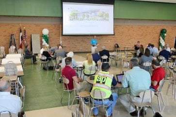 Kelly Horn, AISD director of facilities, addresses meeting of potential contractors for the Fine Arts Center and Athletics Complex