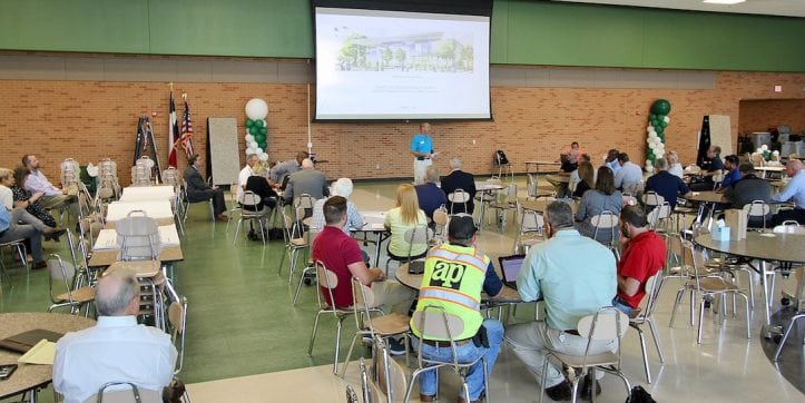 Kelly Horn, AISD director of facilities, addresses meeting of potential contractors for the Fine Arts Center and Athletics Complex