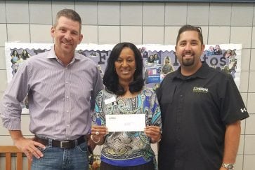 Imperial delivers donation to Principal Carter at Bebensee Elementary