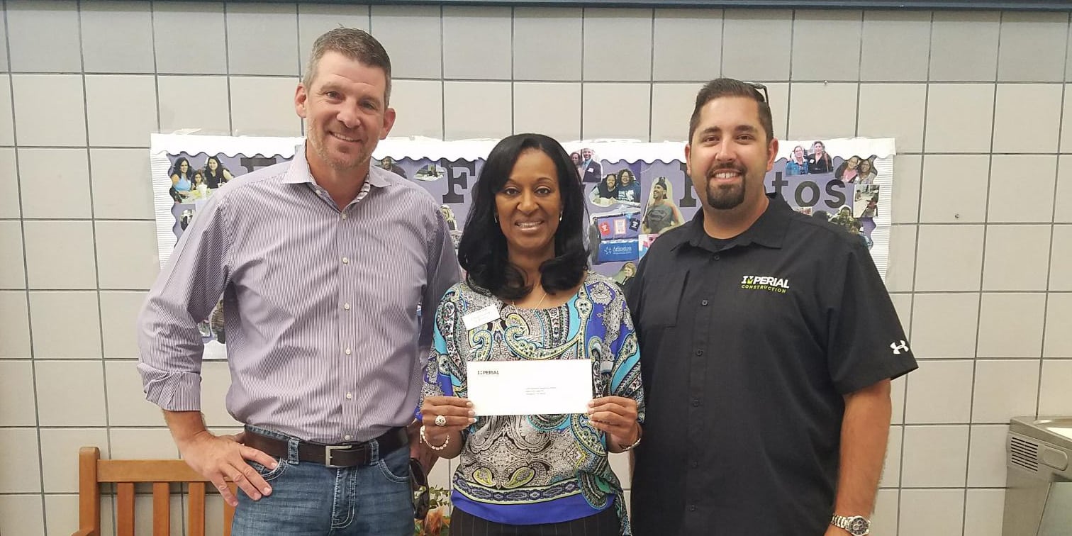 Imperial delivers donation to Principal Carter at Bebensee Elementary
