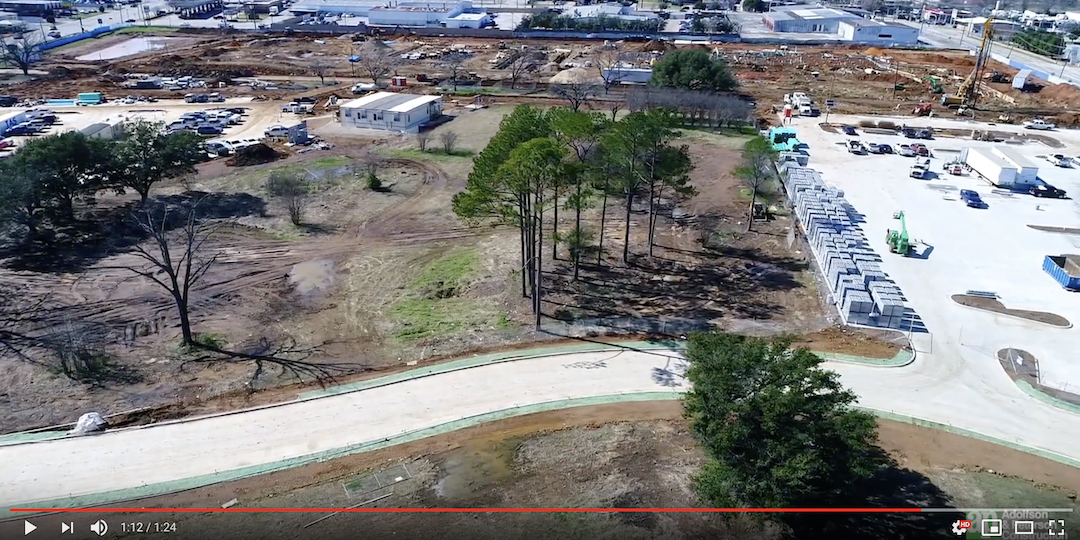 Screenshot of aerial video of new Eatern Star Road and construction site of future Fine Arts Center and Athletics Complex