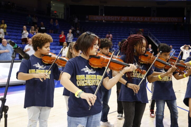 Gunn orchestra performs national anthem before UTA volleyball game