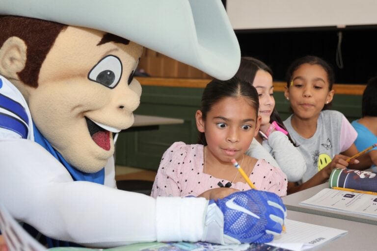 Dallas Cowboys and Blockchain.com donate math books to third graders