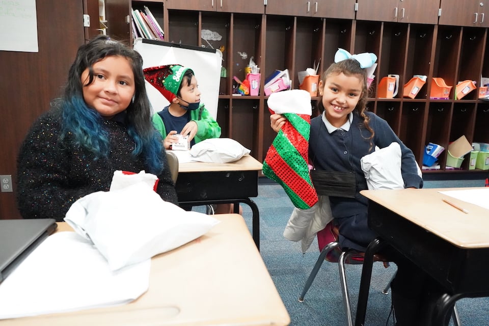 Arlington Sunrise Rotary gives stockings and toys to students