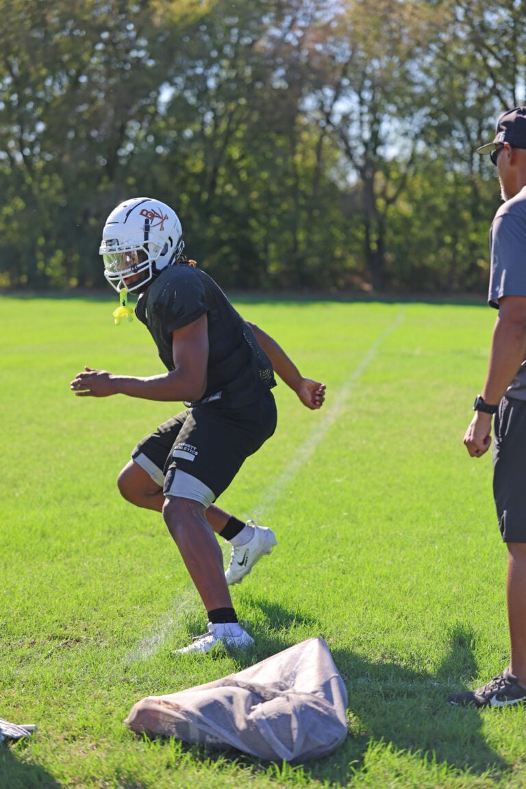 Phifer practicing football drills