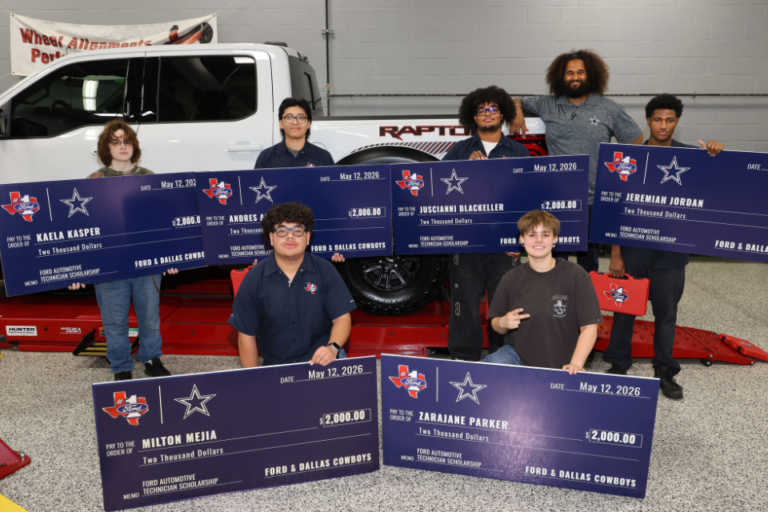 A group of people stand proudly, each holding a large check for $2,000. They are in front of a Ford vehicle inside a garage. The checks are awarded by Ford and the Dallas Cowboys. Names on the checks include Kaelan Kasper, Milton Mejia, Andres P., Josquaine Blackeller, Zarajaine Parker, and Jeremiah Jordan.