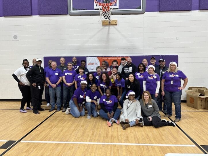 FedEx volunteers at Crow Leadership Academy to give students coats