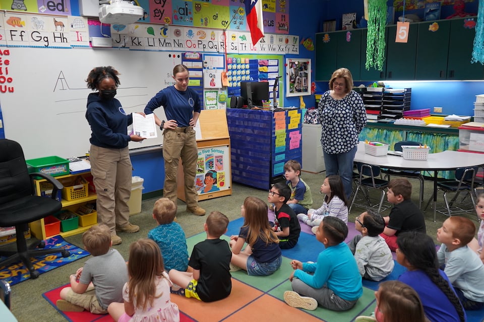police academy students visit Little Elementary