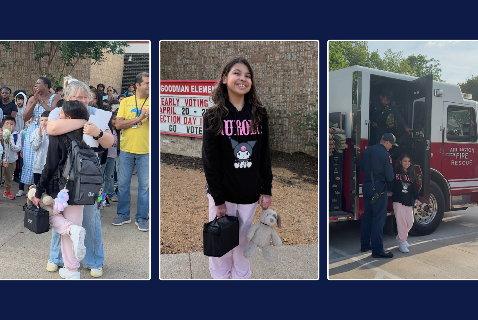 A fourth‑grade girl returns to Goodman Elementary after recovering from a house fire. In the first photo, she hugs an adult outside the school as students and staff clap around her; she holds a black lunchbox and a stuffed toy. In the second photo, she smiles in front of a school sign while wearing a black Kuromi sweatshirt, pink pants, and white shoes. In the third photo, she stands beside an Arlington Fire Rescue truck, interacting with two firefighters who helped escort her to school.