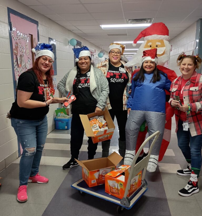 St. Nick drops gifts in students' shoes at Wimbish World Language Academy