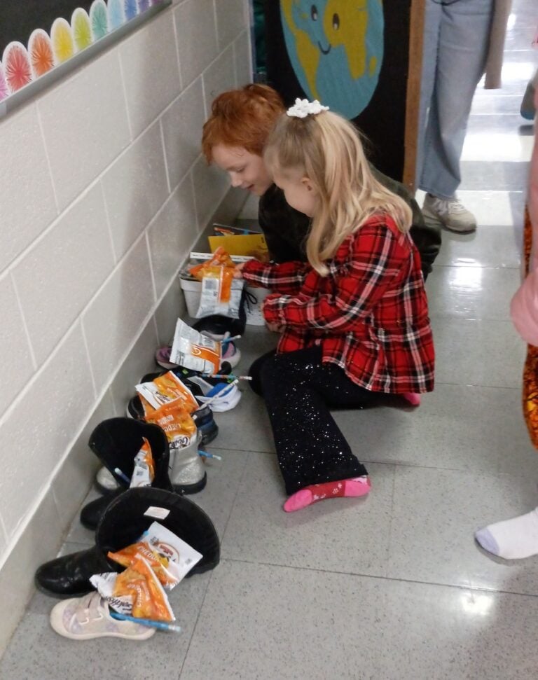 St. Nick drops gifts in students' shoes at Wimbish World Language Academy