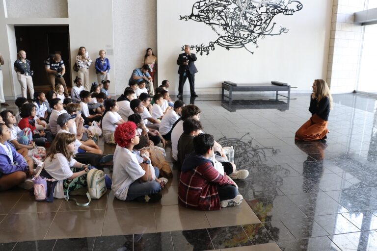 Jessica McCarthy speaks to the students at the art tour