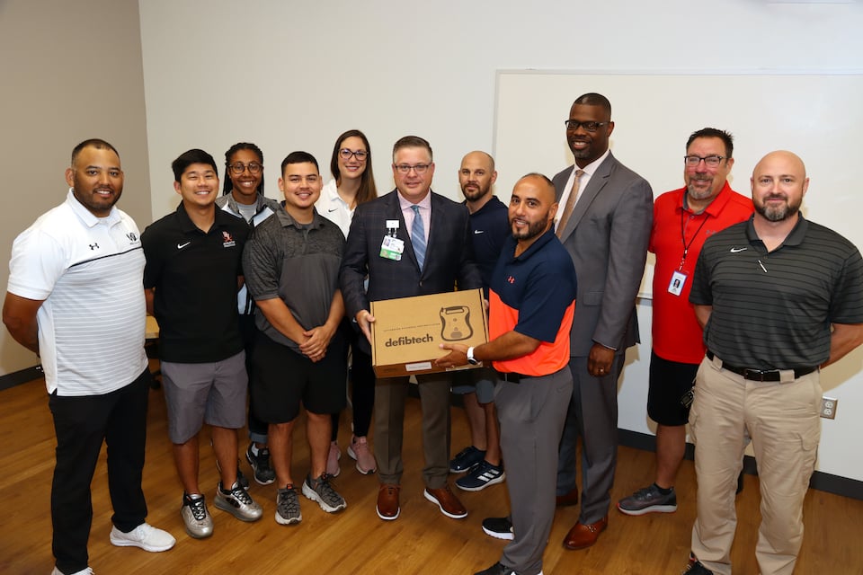 Living for Zachary AED donation for Arlington ISD