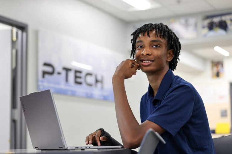 a P-Tech at Lamar High School student studying on laptop