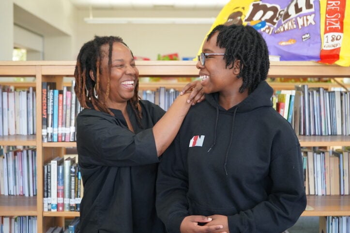 senior Oforitsenere Bodunrin with her mother in Martin library