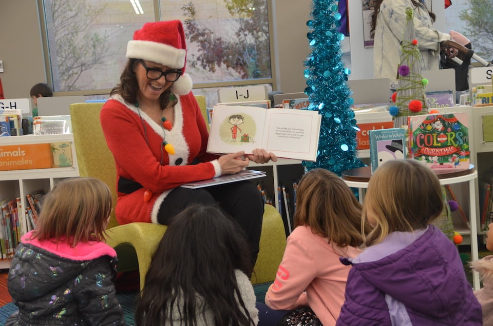 Pope Principal reads holiday books at George W. Hawkes Downtown Library