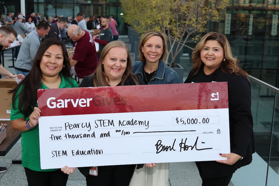 STEM kits for Pearcy STEM Academy students donated by Garver along with $5,000