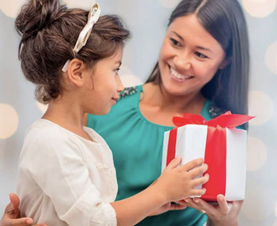 Woman giving child present