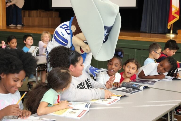 Dallas Cowboys and Blockchain.com donate math books to third graders