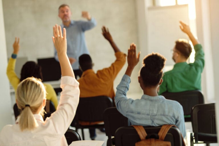 Students raising hands