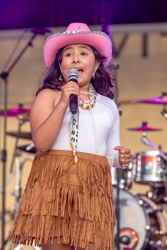 Natalia Vega performing in Spanish at the Levitt Pavilion